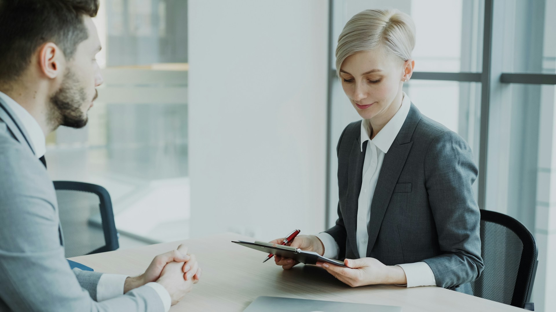 An attorney reviewing case documents with a client